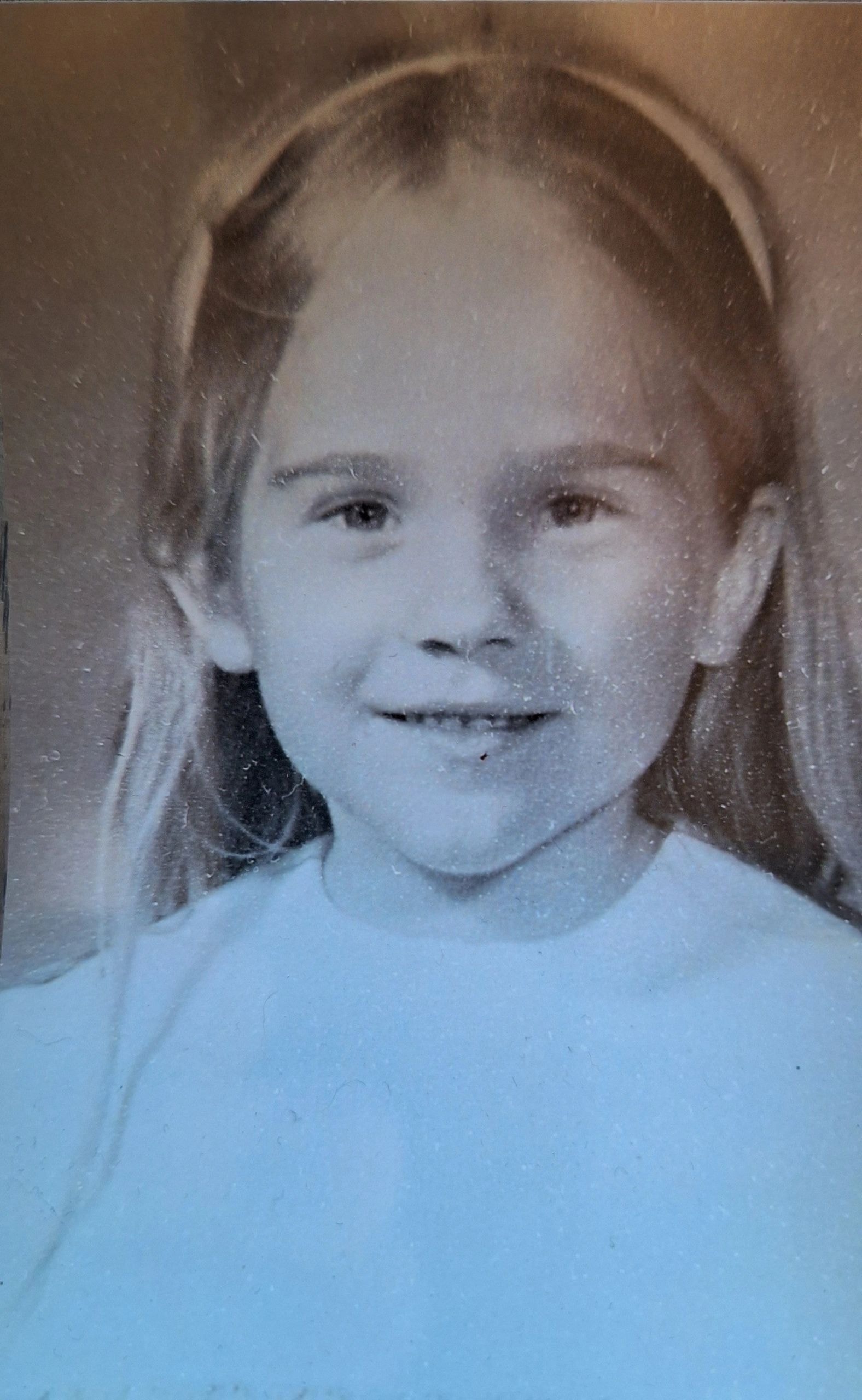 Vintage black and white school portrait of a young girl — Guess who and how old?